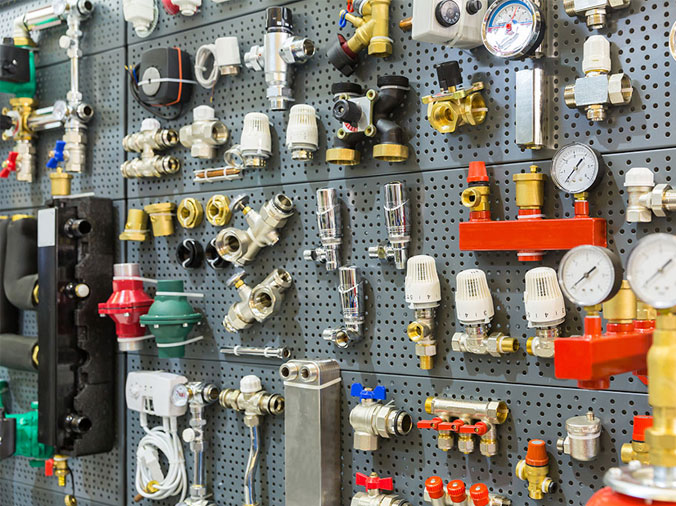 Various plumbing fittings in a plumbing supply store